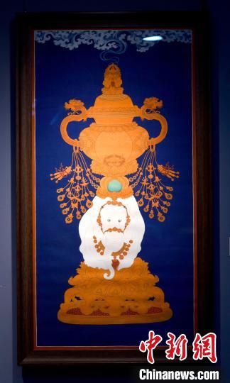 圖為5月16日，展覽中的新創(chuàng)唐卡作品《瑞象承香》?！±盍?攝